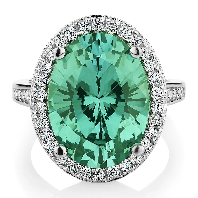 Chic, Trendy, And Affordable Jewelry Sale Dress ring with ocean green simulant and 0.78 carats* of diamond simulants in sterling silver Chic, Trendy, And Affordable Jewelry Sale Dress ring with ocean green simulant and 0.78 carats* of diamond simulants in sterling silver