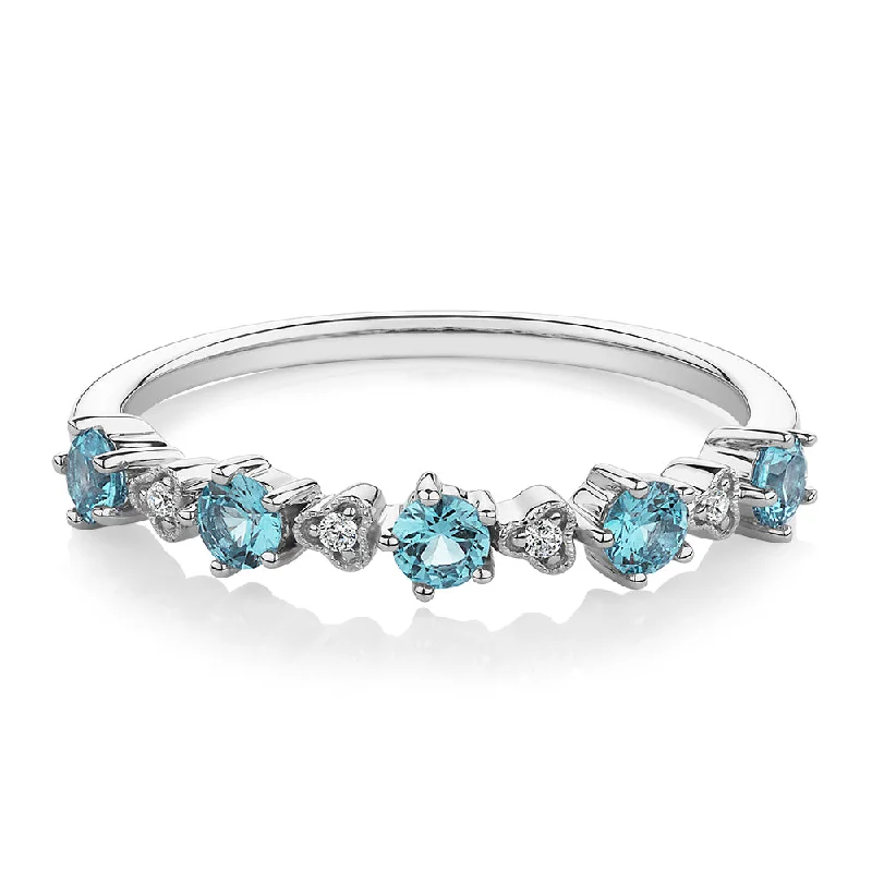 Dazzling Deals On Necklaces, Bracelets, And More Wedding or eternity band with blue topaz and diamond simulants in 10 carat white gold