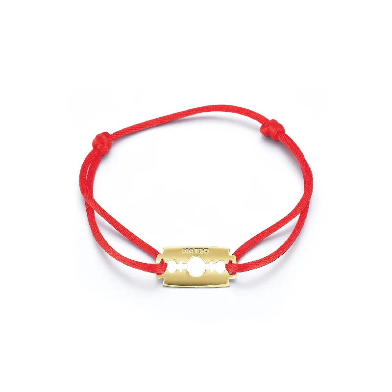 Shop Dazzling Rings, Earrings, And More At Special Discounts 14kt Razor Blade on Red Nylon Bracelet Shop Dazzling Rings, Earrings, And More At Special Discounts 14kt Razor Blade on Red Nylon Bracelet